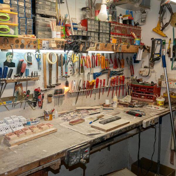 Busy home workshop with epoxy flooring by Epoxy Flooring Guys Sydney. A tough, low-maintenance surface built to handle tools, spills and weekend projects.