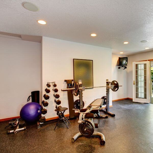 Home gym with durable epoxy flooring in Sydney. Coating resists weights, sweat and equipment use while keeping the space easy to clean and low maintenance.