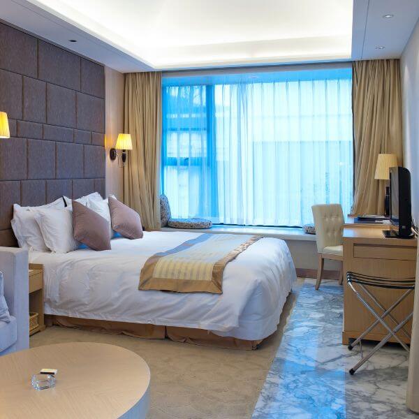 Modern bedroom with internal concrete floors finished in epoxy by Epoxy Flooring Guys Sydney. A sleek, low-maintenance surface ideal for daily living.