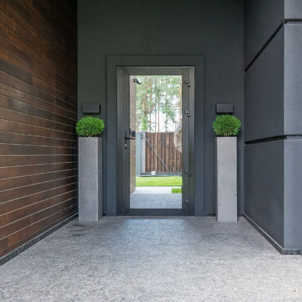 Modern entryway with textured epoxy flooring by Epoxy Flooring Guys Sydney. A neat, slip-resistant finish that’s built to handle foot traffic and outdoor exposure.