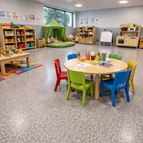Epoxy flooring for childcare centres in Sydney, showing a clean classroom with high-traffic epoxy floor by Epoxy Flooring Guys Sydney.